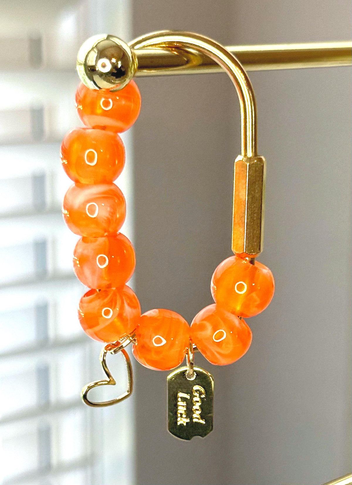 Golden Carabiner Bag Charm with Heart and Lucky Tag – Orange Beaded Purse Accessory