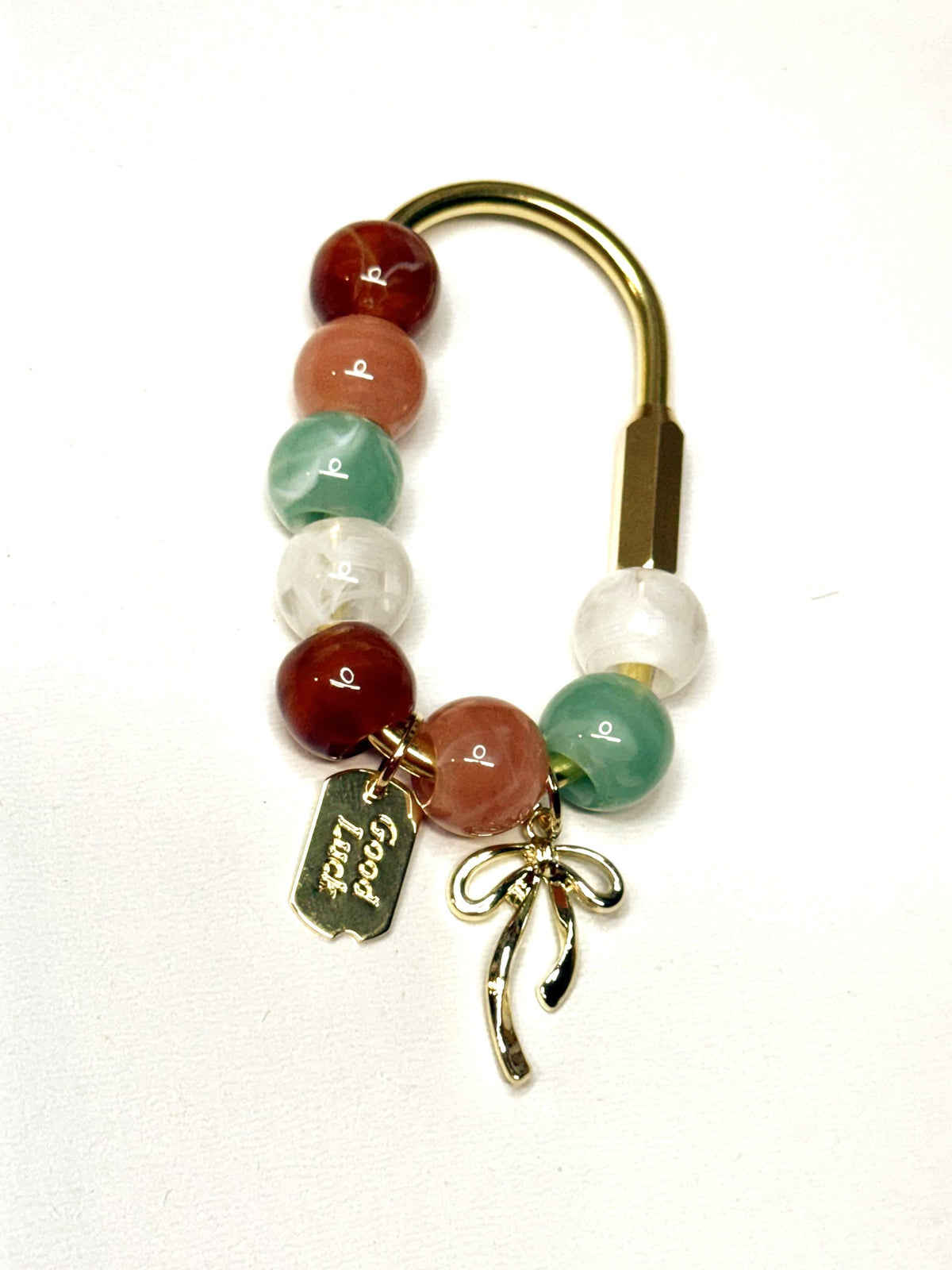 Beaded Golden Carabiner Bag Charm with Bow and Good Luck Tag – Handcrafted Purse Accessory